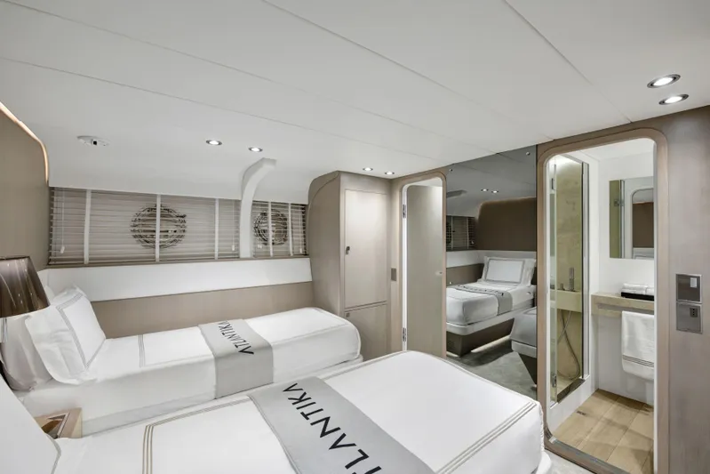 Atlantika Yacht Photos Pics Luxurious cabin interior of a 2013 custom sailing yacht with twin beds and modern amenities.