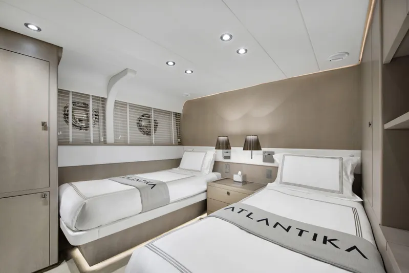 Atlantika Yacht Photos Pics Luxurious twin cabin interior of 2013 custom sailing yacht, featuring modern design and elegant decor.