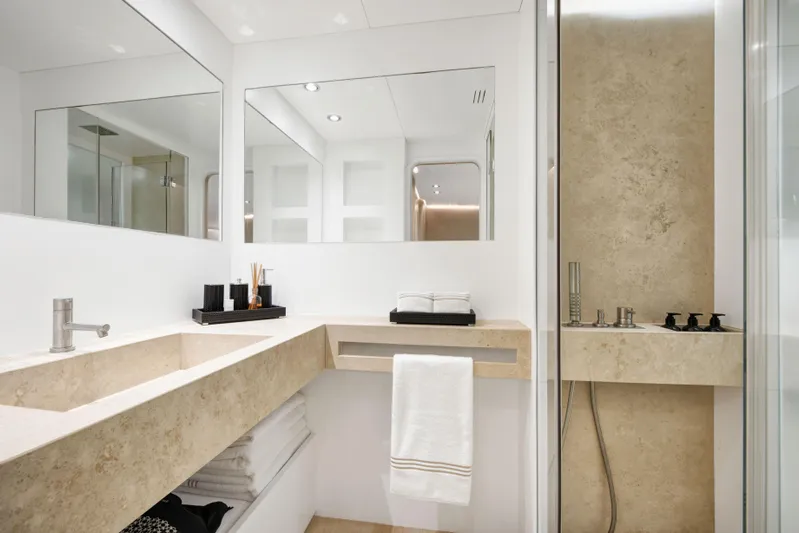 Atlantika Yacht Photos Pics Luxurious bathroom on a 2013 custom sailing yacht with modern fixtures and elegant design.