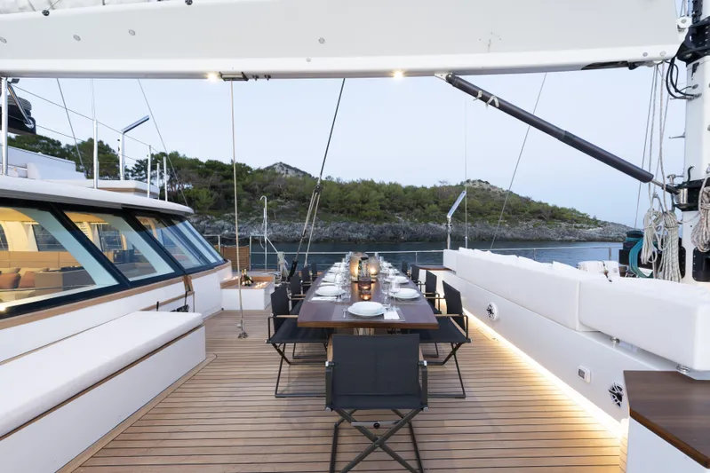 Atlantika Yacht Photos Pics Luxurious 2013 custom sailing yacht with elegant outdoor dining setup on deck.