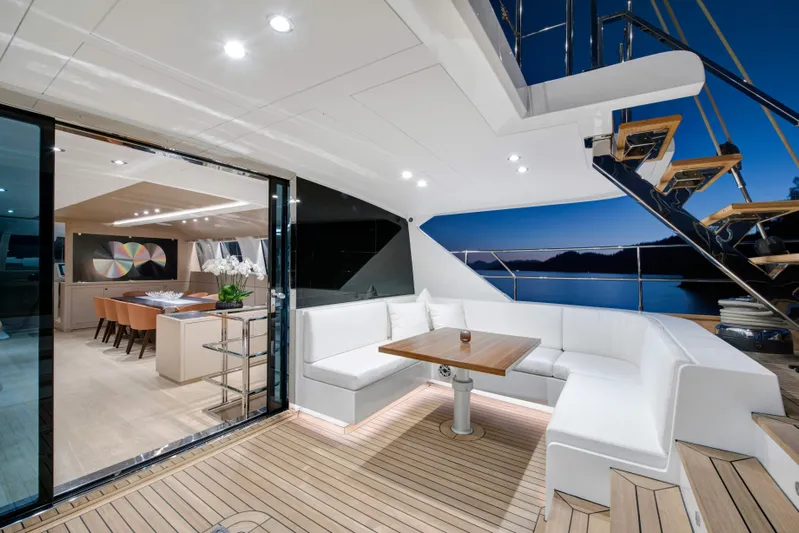 Atlantika Yacht Photos Pics Luxurious 2013 custom sailing yacht with elegant interior and spacious deck seating at sunset.