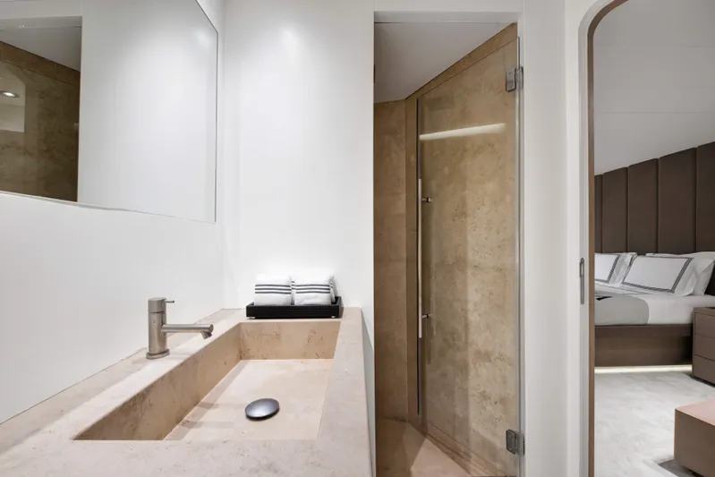 Atlantika Yacht Photos Pics Luxurious bathroom on a 2013 custom sailing yacht, featuring modern sink and glass shower.