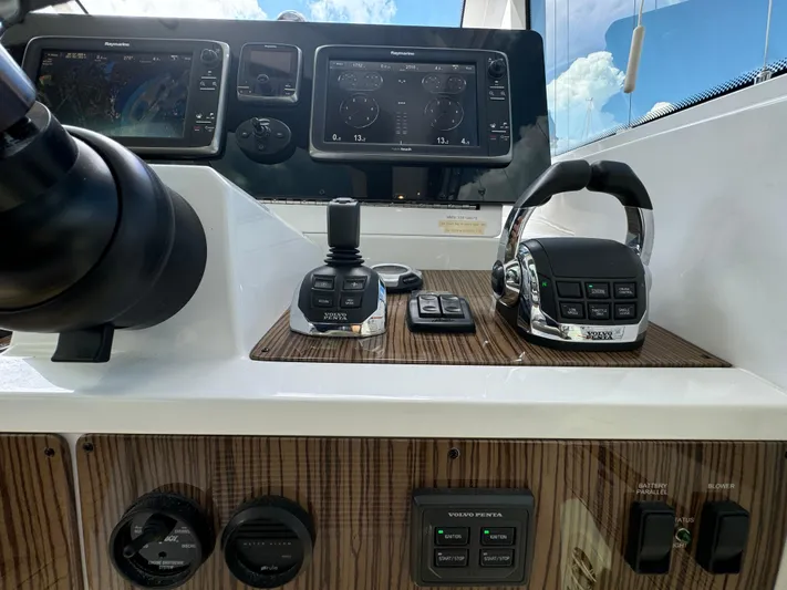  Yacht Photos Pics Control panel of 2015 Cruisers Yachts 48 Cantius with navigation and throttle systems.