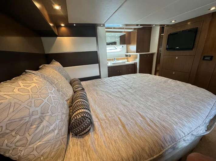 Yacht Photos Pics Luxurious bedroom interior of 2015 Cruisers Yachts 48 Cantius with modern design and amenities.