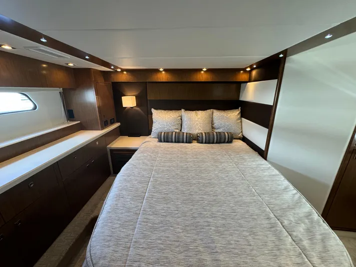  Yacht Photos Pics Luxurious bedroom interior of 2015 Cruisers Yachts 48 Cantius with modern design and cozy bedding.