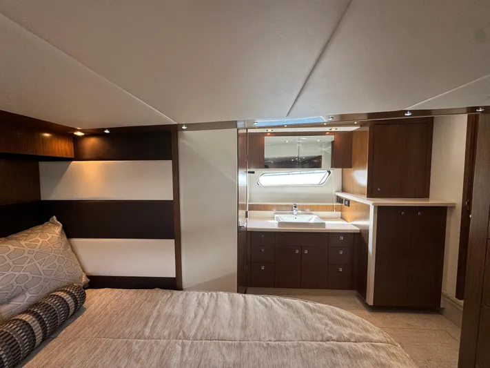  Yacht Photos Pics Luxurious cabin interior of 2015 Cruisers Yachts 48 Cantius with modern wood finishes.