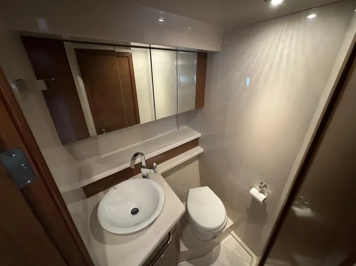  Yacht Photos Pics Luxurious bathroom in 2015 Cruisers Yachts 48 Cantius, featuring modern fixtures and elegant design.