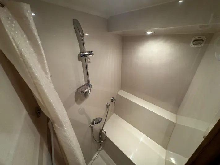  Yacht Photos Pics Shower area in 2015 Cruisers Yachts 48 Cantius, featuring modern fixtures and lighting.