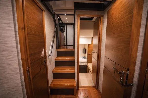 No Agenda Yacht Photos Pics Interior of 2016 Tiara Yachts C44 Coupe with wooden stairs and doors.