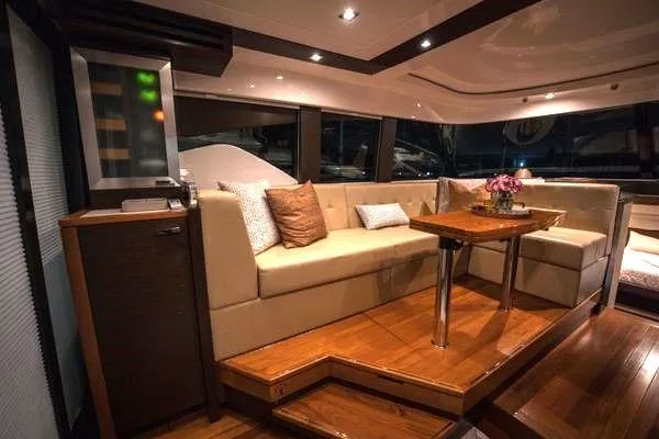 No Agenda Yacht Photos Pics Luxurious interior of 2016 Tiara Yachts C44 Coupe with elegant seating and wooden accents.