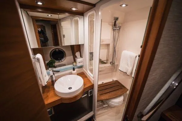 No Agenda Yacht Photos Pics Luxurious bathroom in 2016 Tiara Yachts C44 Coupe, featuring modern fixtures and elegant design.