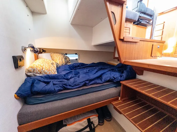  Yacht Photos Pics Cozy cabin interior of 2018 Targa 27.1 boat with bed and wooden stairs.