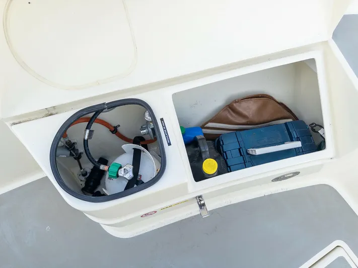  Yacht Photos Pics Storage compartment on a 2018 Targa 27.1 boat with equipment and supplies.