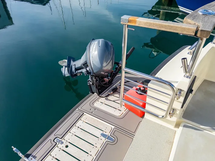  Yacht Photos Pics 2018 Targa 27.1 boat with outboard motor and fuel tank at dock.