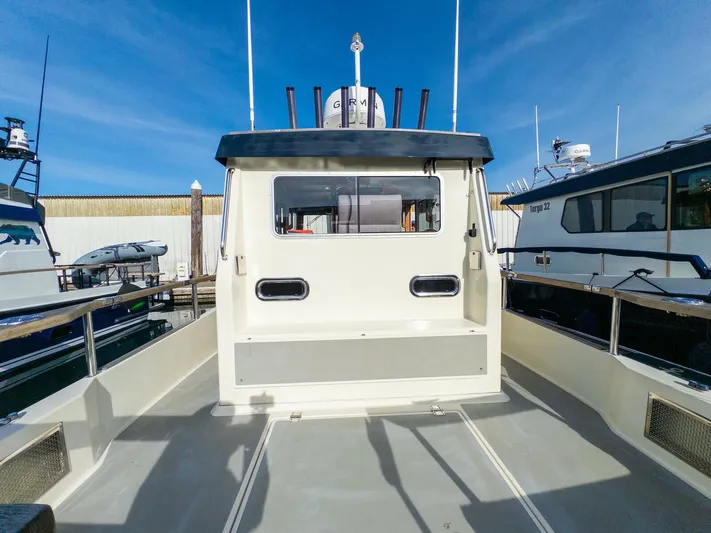  Yacht Photos Pics Targa 27.1 boat, 2018 model, docked with clear blue sky background.