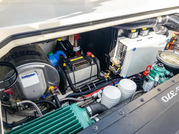  Yacht Photos Pics Engine compartment of a 2018 Targa 27.1 boat, showcasing various mechanical components and systems.