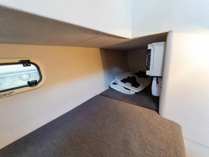  Yacht Photos Pics Cozy cabin interior of 2018 Targa 27.1 boat with window and control panel.