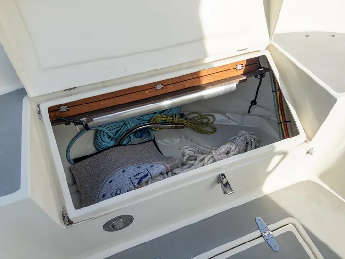  Yacht Photos Pics Storage compartment on a 2018 Targa 27.1 boat, containing ropes and equipment.