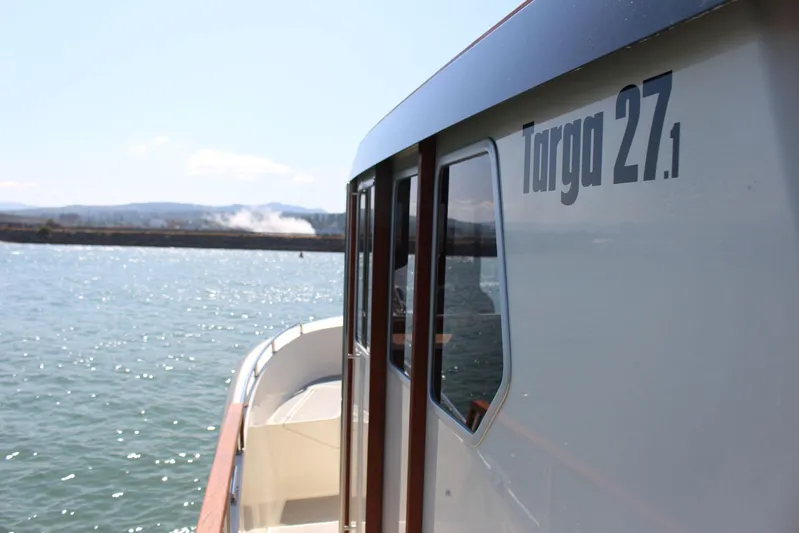  Yacht Photos Pics 2018 Targa 27.1 boat on water, side view with clear sky.