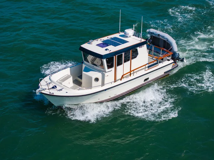  Yacht Photos Pics 2018 Targa 27.1 boat cruising on open water, showcasing sleek design and performance.