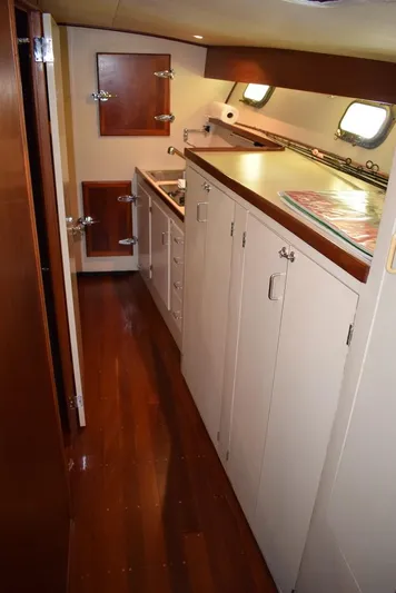 Cygnet Yacht Photos Pics Interior of a 1960 Rybovich Sportfisherman yacht with wooden flooring.