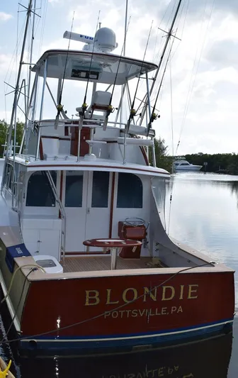 Cygnet Yacht Photos Pics 1960 Rybovich Sportfisherman boat on water, rear view.
