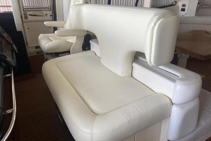  Yacht Photos Pics Luxurious white leather seating on a 2000 Sunseeker Predator 80 yacht interior.