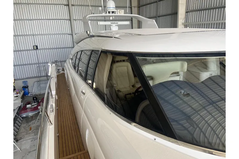  Yacht Photos Pics Sunseeker Predator 80 yacht, 2000 model, docked in a metal storage facility.