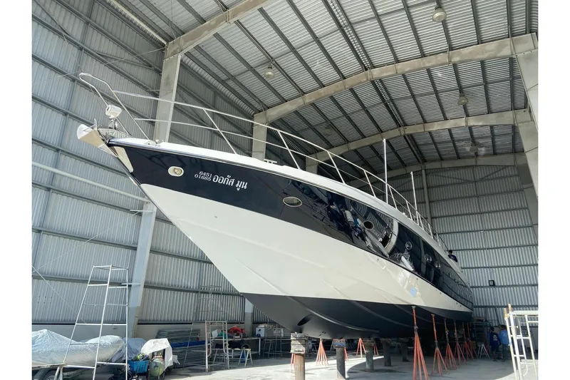  Yacht Photos Pics Sunseeker Predator 80 yacht from 2000 in a large indoor storage facility.