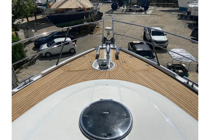  Yacht Photos Pics Bow view of 2000 Sunseeker Predator 80 yacht in a marina setting.