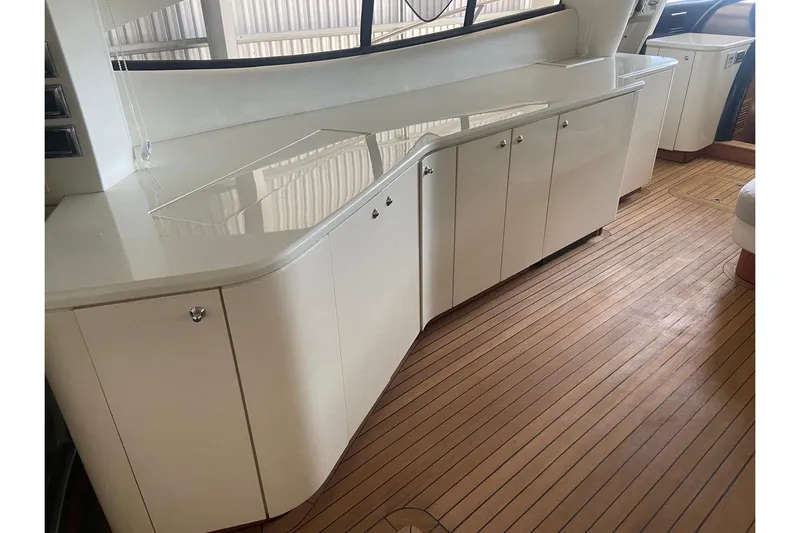  Yacht Photos Pics Sunseeker Predator 80 yacht interior with sleek cabinetry and wooden flooring, 2000 model.