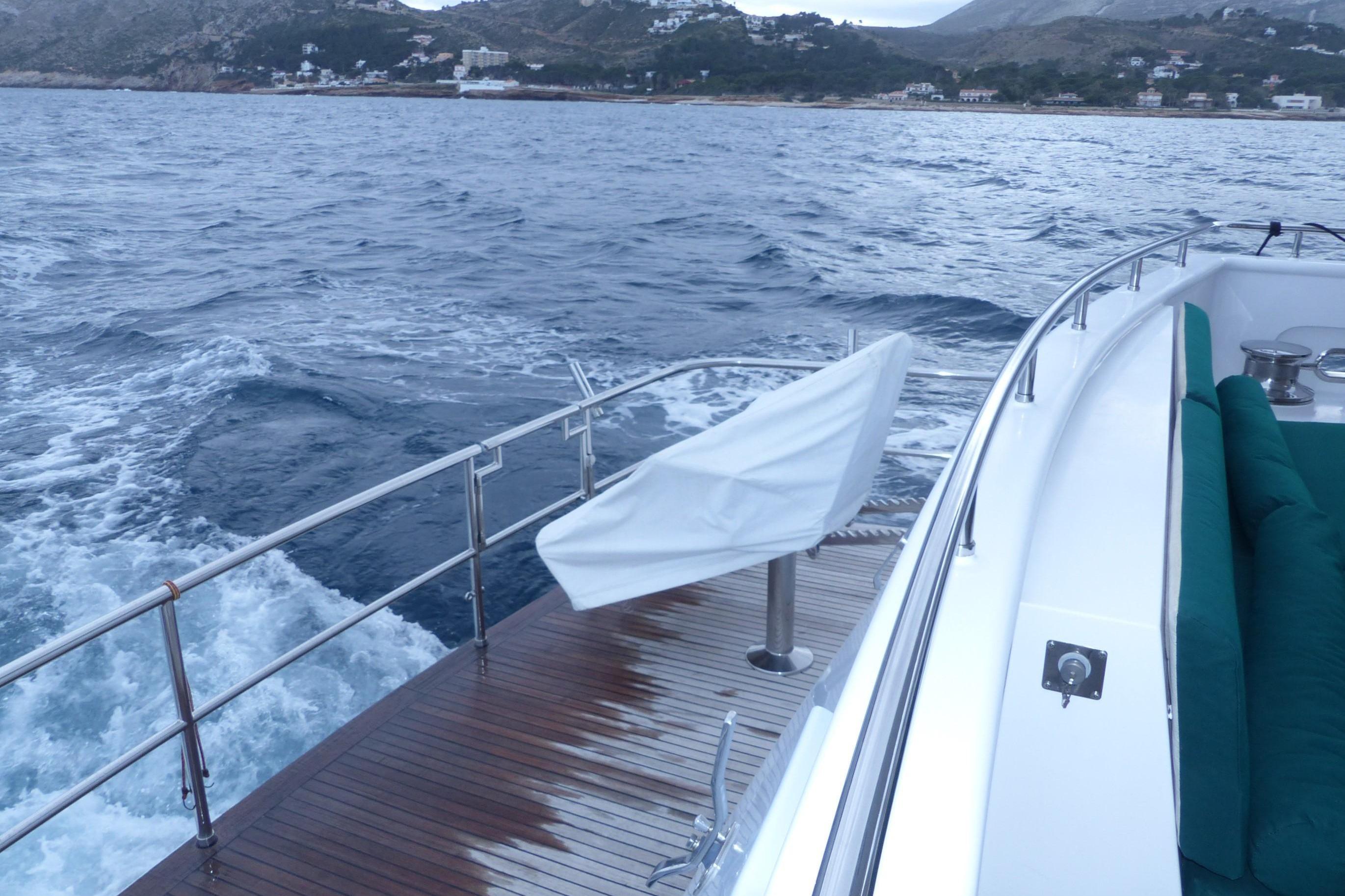 Explorer Seaton 85 yacht deck with ocean view, 2004 model, near coastal landscape.