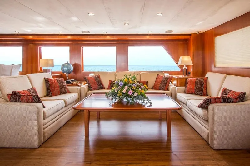  Yacht Photos Pics Luxurious interior of 2004 Explorer Seaton 85 yacht with elegant seating and ocean view.