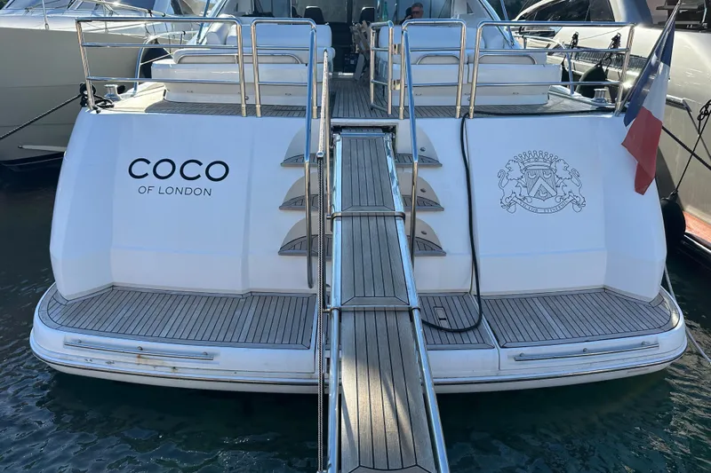  Yacht Photos Pics Luxury yacht "Coco of London," Princess V70, 2006 model, docked with French flag.
