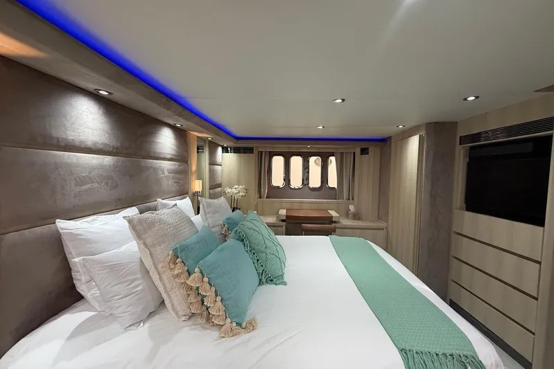  Yacht Photos Pics Luxurious 2006 Princess V70 yacht bedroom with elegant decor and ambient lighting.