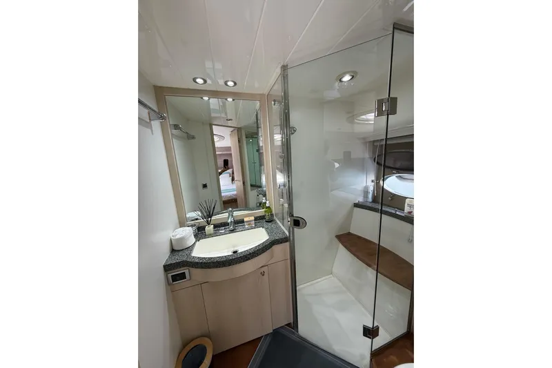  Yacht Photos Pics Luxurious bathroom in 2006 Princess V70 yacht with glass shower and modern vanity.