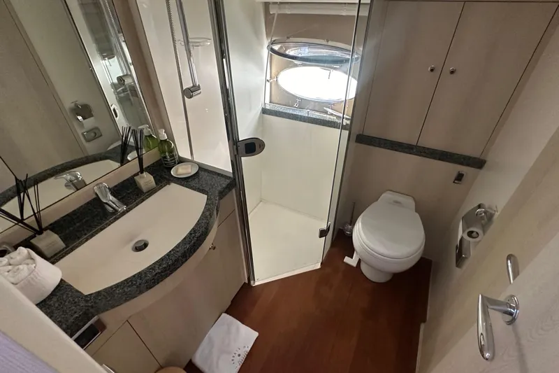  Yacht Photos Pics Luxurious 2006 Princess V70 yacht bathroom with modern fixtures and elegant design.