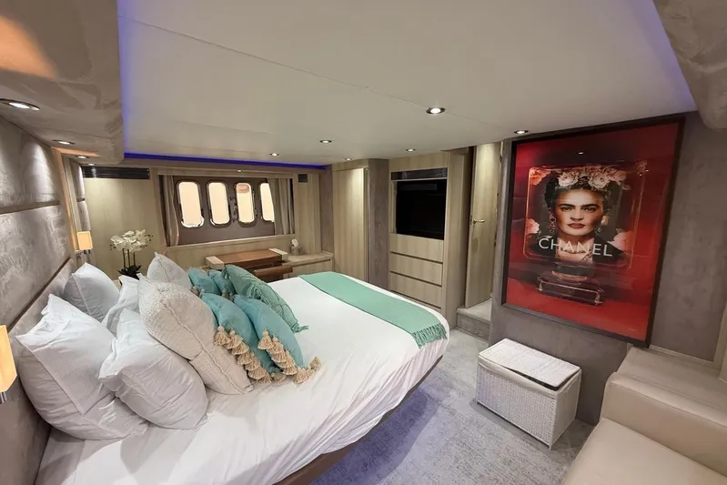  Yacht Photos Pics Luxurious 2006 Princess V70 yacht bedroom with elegant decor and modern amenities.