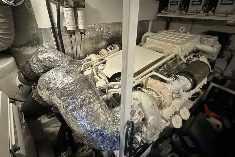  Yacht Photos Pics Engine room of a 2006 Princess V70 yacht, showcasing complex machinery and components.