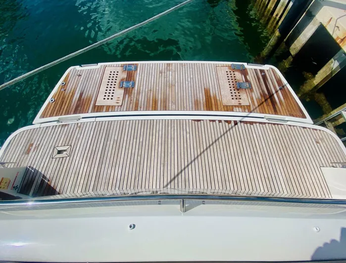  Yacht Photos Pics Teak deck of a 2015 Prestige 500 yacht at a marina.