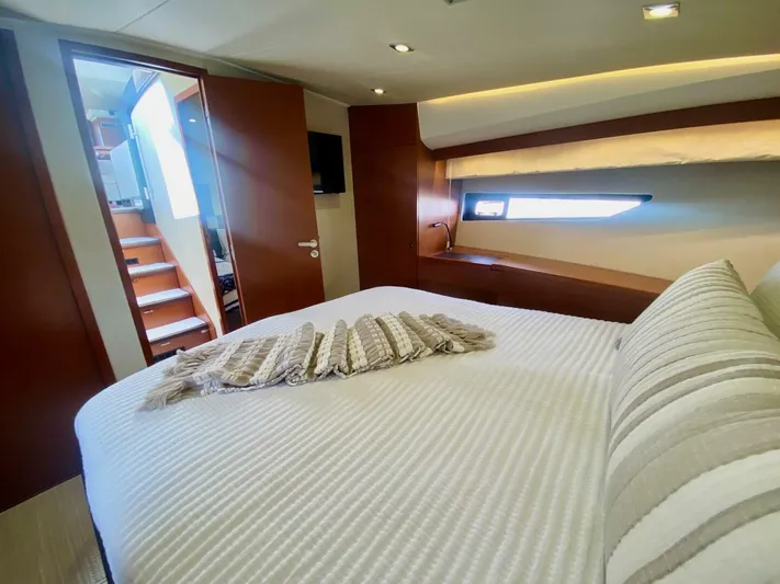  Yacht Photos Pics Luxurious bedroom interior of 2015 Prestige 500 yacht with modern design and cozy bedding.