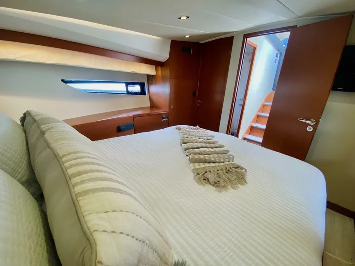  Yacht Photos Pics Luxurious bedroom interior of 2015 Prestige 500 yacht with modern design and cozy bedding.