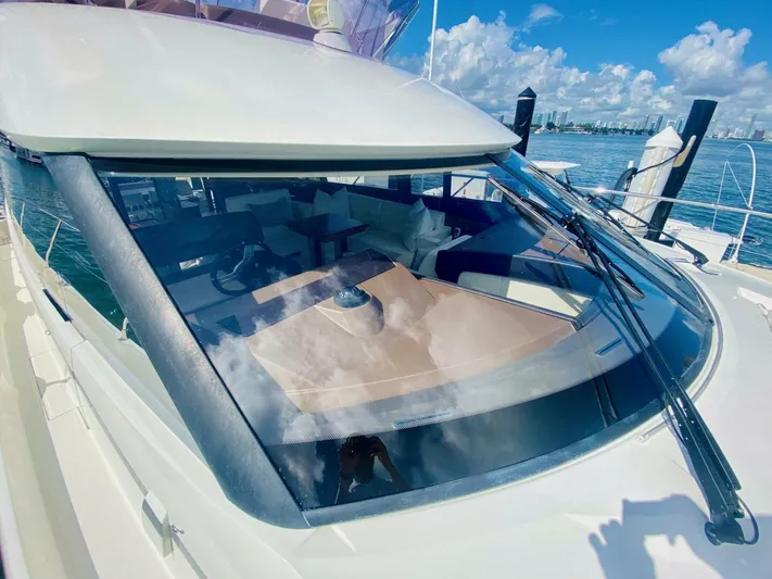  Yacht Photos Pics 2015 Prestige 500 yacht with sleek design, docked by the water under a clear blue sky.