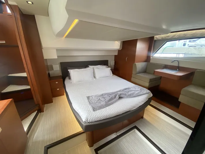  Yacht Photos Pics Luxurious cabin interior of a 2015 Prestige 500 yacht with modern furnishings and natural light.