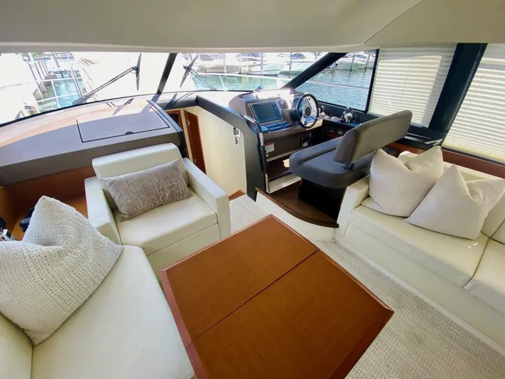  Yacht Photos Pics Luxurious interior of a 2015 Prestige 500 yacht with plush seating and modern helm.