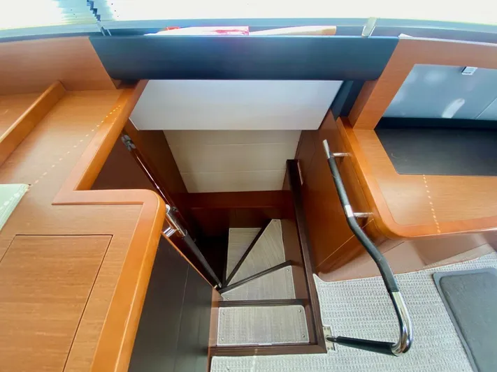  Yacht Photos Pics Staircase inside 2015 Prestige 500 yacht with wooden finish and metal handrails.
