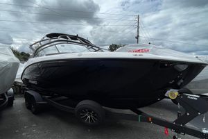 2026 Yamaha AR250 boat on trailer under cloudy sky.
