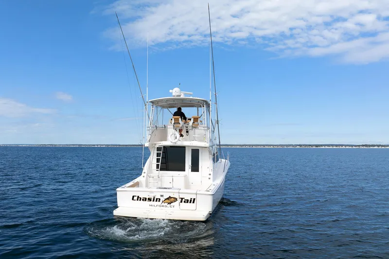 Chasing Tail Yacht Photos Pics 2007 Tiara Yachts 3900 Convertible cruising on open water.