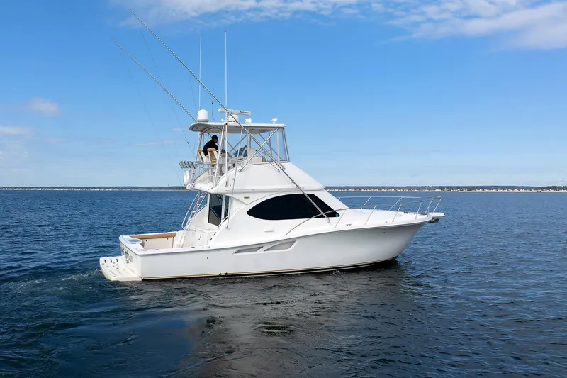 Chasing Tail Yacht Photos Pics 2007 Tiara Yachts 3900 Convertible cruising on open water under blue sky.