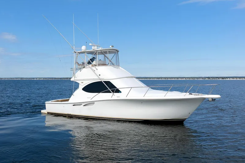Chasing Tail Yacht Photos Pics 2007 Tiara Yachts 3900 Convertible on calm water, clear sky background.